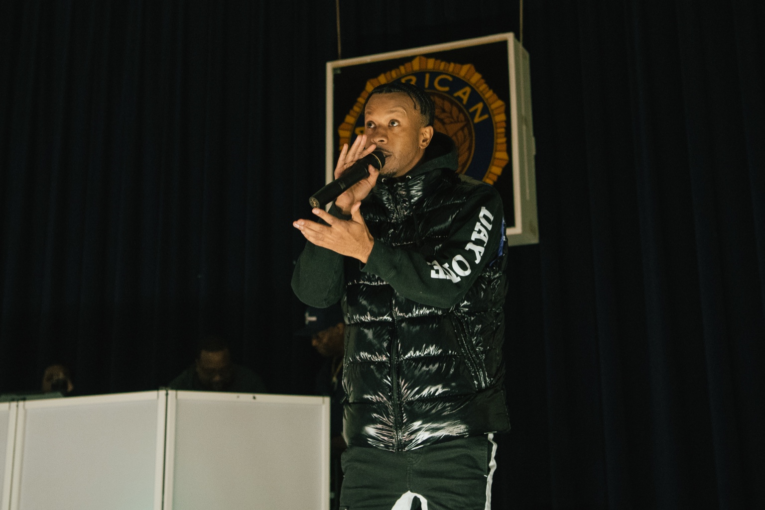 Keenan Laurino performing on stage with microphone